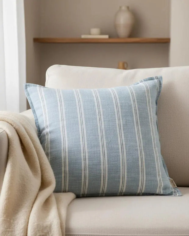 Ocean blue Abersoch stripe cotton cushion cover by Riva Home, featuring soft furnishings design with vibrant blue and white stripes.