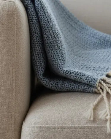 Blue and neutral diamond stitch Hammam style throw blanket by Starlight Express, soft and textured for cozy living spaces.