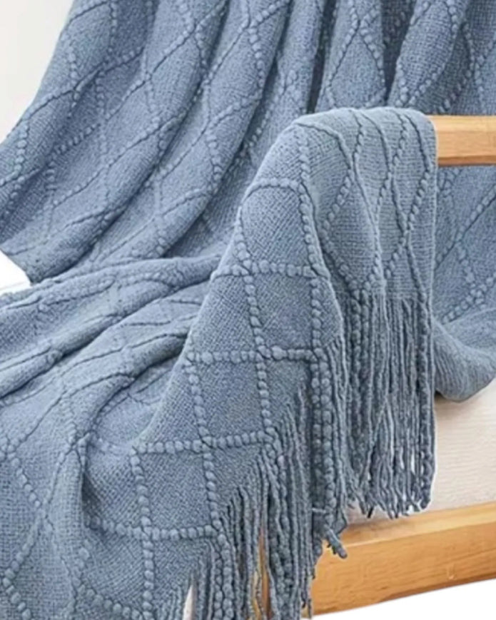 Ocean blue diamond pattern knitted throw blanket by Starlight Express, showcasing soft, cozy textured knit fabric.