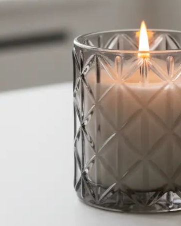 Smokey black large diamond glass candle by Candlelight Products Ltd with Woodsage & Sea Salt scent, featuring a decorative glass container.