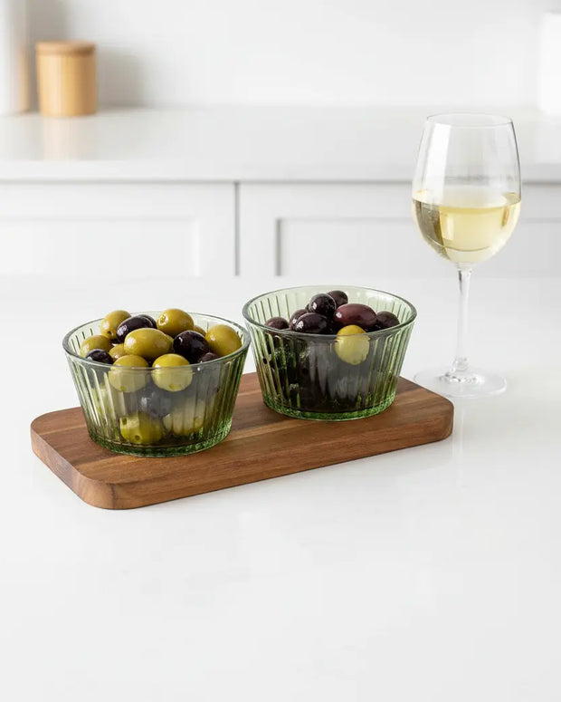 Round green glass dishes on a tray, ideal for kitchen and dining use, by Candlelight Products Ltd.
