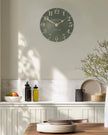 Gallery Direct Thomas Kent 12-inch Arabic wall clock in Lichen Green with bold black numerals and sleek modern design.