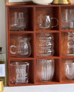Dark wooden mug display shelf unit for kitchen and dining, featuring multiple hooks to hold mugs and cups, by Starlight Express.