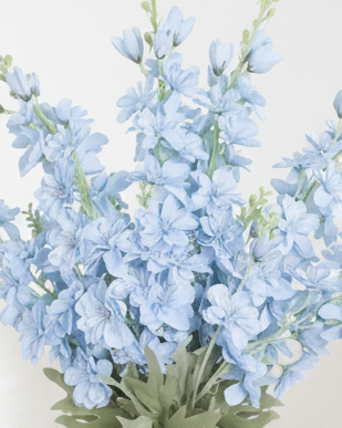 Artificial tall ocean blue lupin flower stem from Starlight Express, showcasing vibrant blue blooms and green foliage.