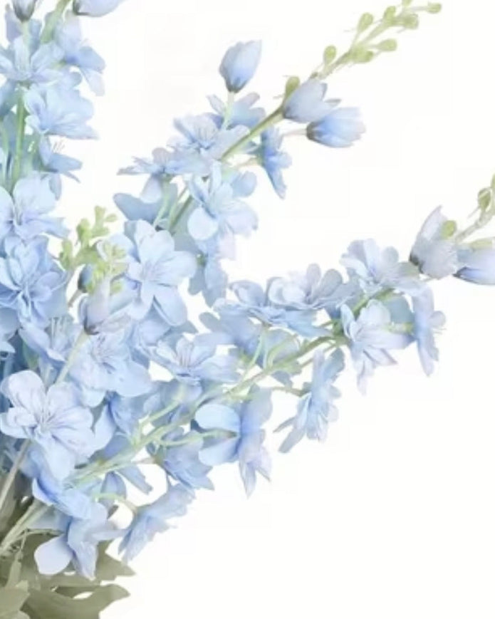 Artificial tall ocean blue lupin flower stem from Starlight Express, showcasing vibrant blue blossoms and green foliage.