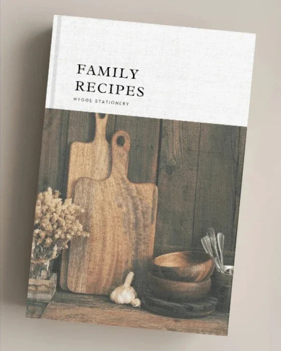 Book titled 'Family Recipes' with a wooden cutting board and kitchen items on the cover.
