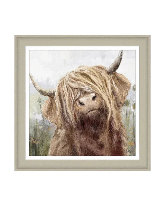 Framed artwork of a highland cow with a blurred background
