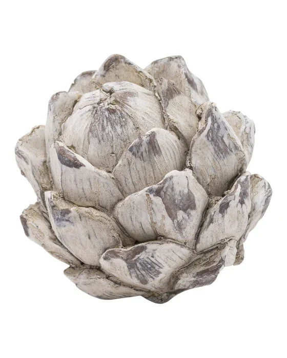 Decorative artichoke sculpture with a rustic finish on a white background
