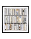 Framed artwork of books with a black frame on a white background