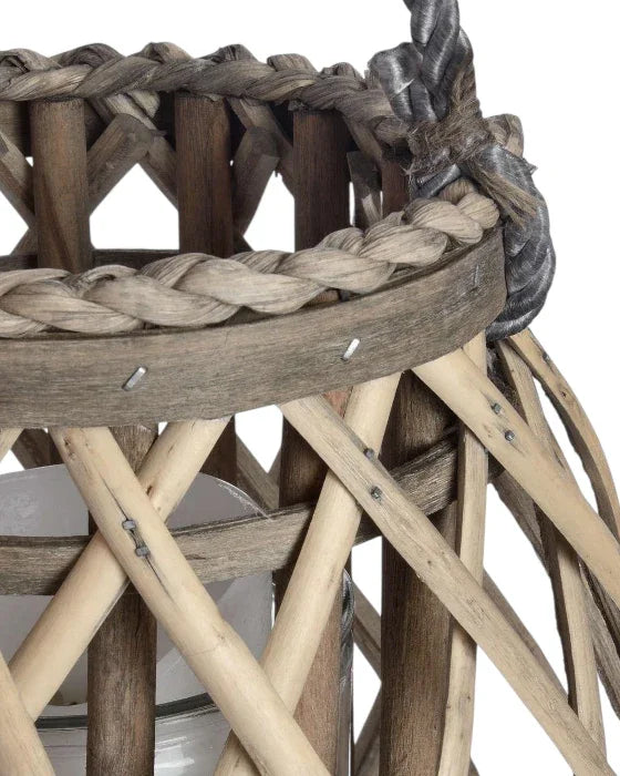 Close-up of a woven basket with braided handle on a white background