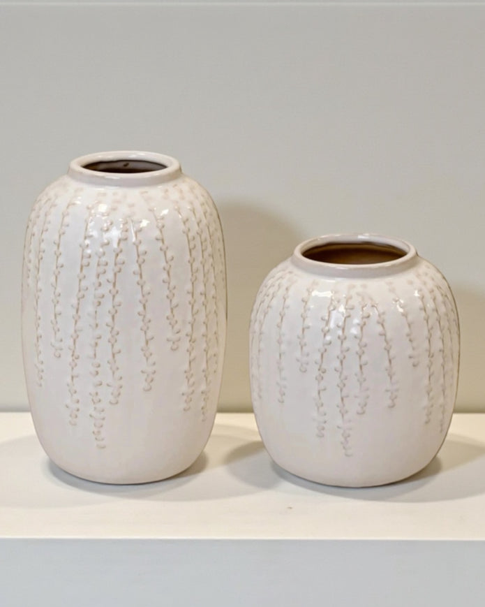 White ceramic vase with trailing leaf print, ideal for home decor, by Satchville.