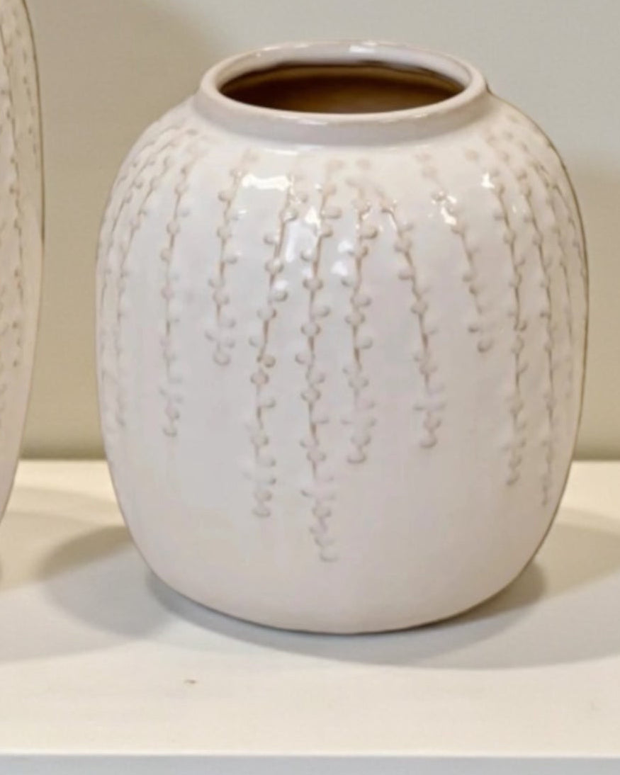 White ceramic vase with trailing leaf print, ideal for home decor, by Satchville, featuring a sleek, modern design for stylish interiors.