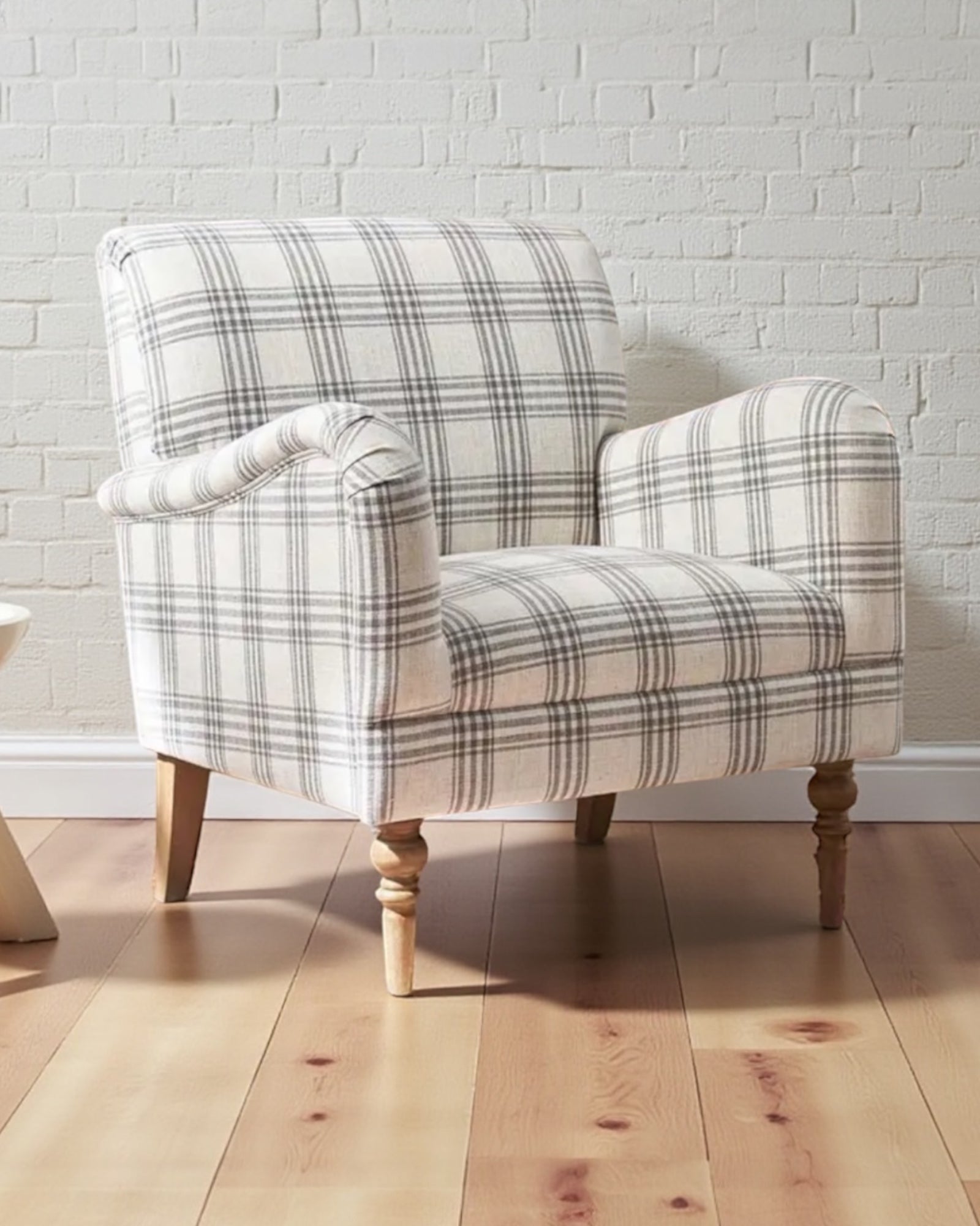 Starlight Express neutral checked arm chair with wooden legs, upholstered fabric, and a modern, comfortable design.