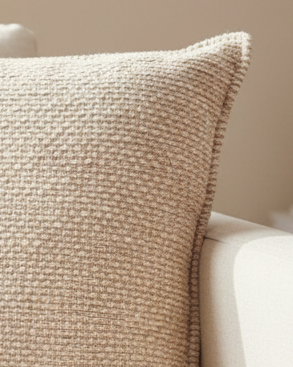 Beige textured square linen cushion cover by Malini, soft furnishings accessory with a stylish, modern design.