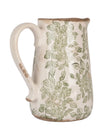 Green and white ceramic flowers jug by Clayre & Eef with detailed floral design and rounded handle, perfect for decorative use.