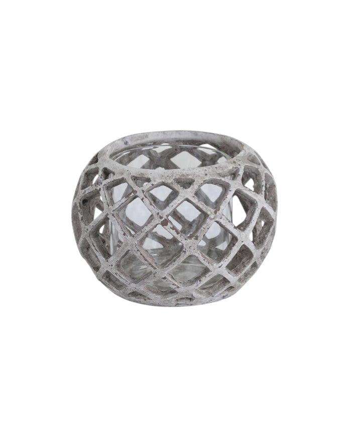 Large round ceramic lattice hurricane lantern for home decor by Hill Interiors, featuring intricate cut-out designs and a candle holder interior.
