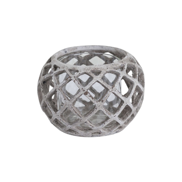 Large round ceramic lattice hurricane lantern for home decor by Hill Interiors, featuring intricate cut-out designs and a candle holder interior.