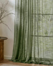 Olive green woven sheer voile curtain panel from Riva Home, soft and lightweight window treatment with textured fabric.