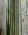 Olive green woven sheer voile curtain panel from Riva Home, soft furnishings for elegant window decor.