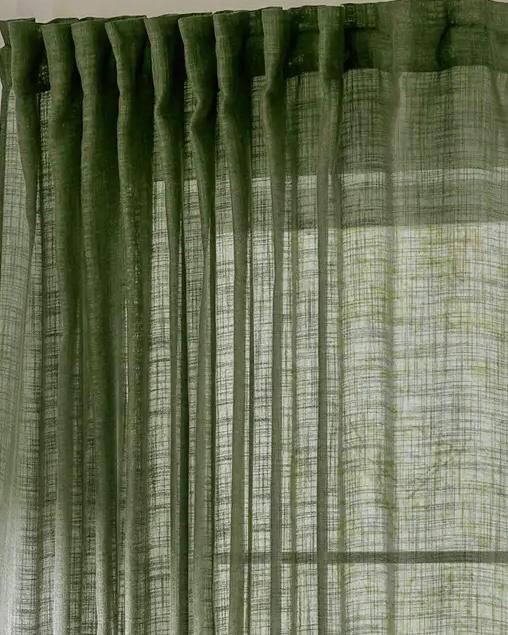 Olive green woven sheer voile curtain panel from Riva Home, soft furnishing with a light, airy texture for window decor.