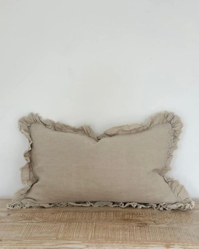 Beige linen cushion cover with ruffled edge, luxury soft furnishings by Ellenvale Trade, showcasing textured fabric and elegant design.