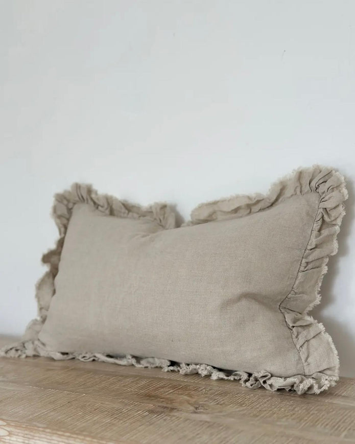Beige luxury linen cushion cover with ruffled edge, soft furnishings by Ellenvale Trade, showcasing elegant textured fabric.