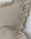 Beige linen cushion cover with ruffled edge, soft furnishings by Ellenvale Trade, featuring a luxurious, neutral design.
