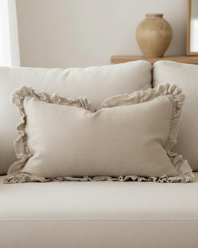 Beige luxury linen cushion cover with ruffled edges, soft furnishings by Ellenvale Trade, showcasing elegant textured fabric.