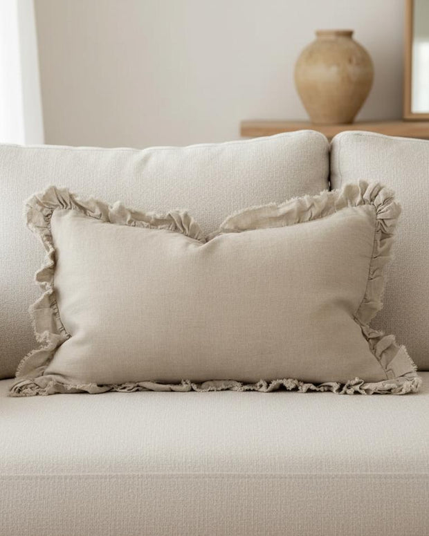 Beige luxury linen cushion cover with ruffled edges, soft furnishings by Ellenvale Trade, showcasing elegant textured fabric.
