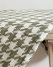 Olive green houndstooth blanket throw from Ellenvale Trade, soft furnishings with a cozy, stylish pattern.