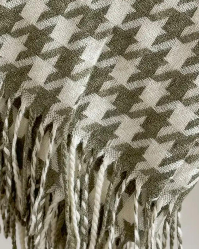 Olive green houndstooth blanket throw from Ellenvale Trade, soft and cozy for home decor or lounging.