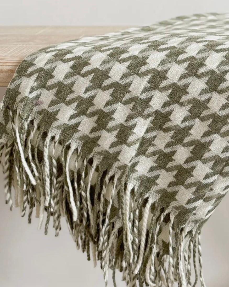 Olive green houndstooth blanket throw from Ellenvale Trade, soft furnishings with a cozy, stylish pattern.
