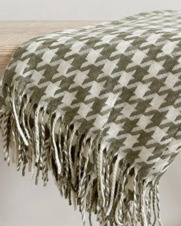 Olive green houndstooth blanket throw from Ellenvale Trade, soft furnishings with a cozy, stylish pattern.