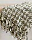 Olive green houndstooth blanket throw from Ellenvale Trade, soft furnishings with a cozy, stylish pattern.