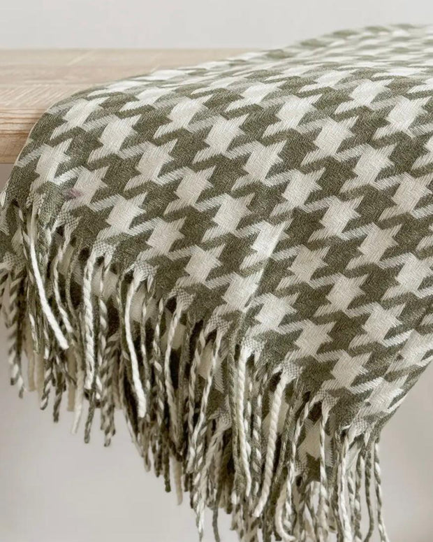 Olive green houndstooth blanket throw from Ellenvale Trade, soft furnishings with a cozy, stylish pattern.