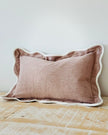 Dusty pink rectangle cushion cover with scalloped edges, made of soft furnishings material by Ellenvale Trade.