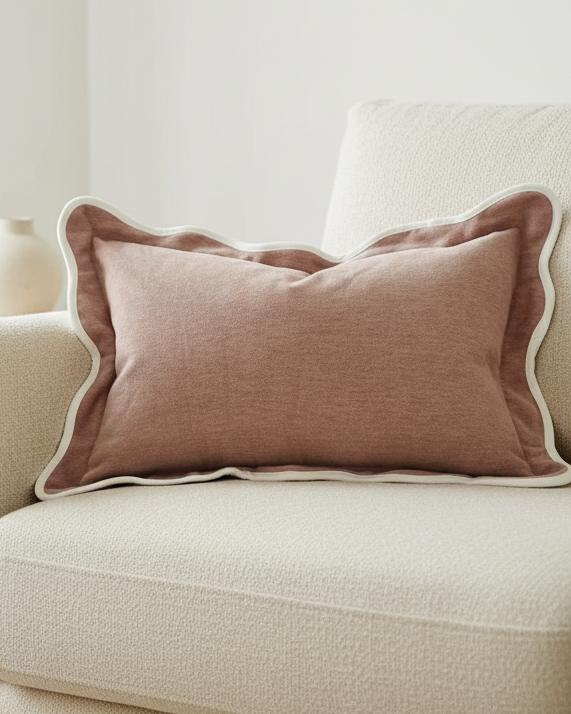 Dusty pink rectangular scalloped cushion cover by Ellenvale Trade, soft furnishings with decorative scalloped edges.