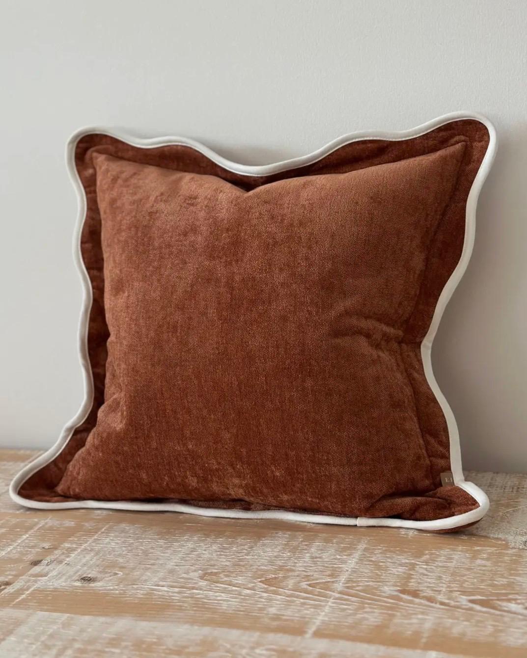 Rust brown and cream scalloped cushion cover by Ellenvale Trade, soft furnishings with decorative scalloped edges.
