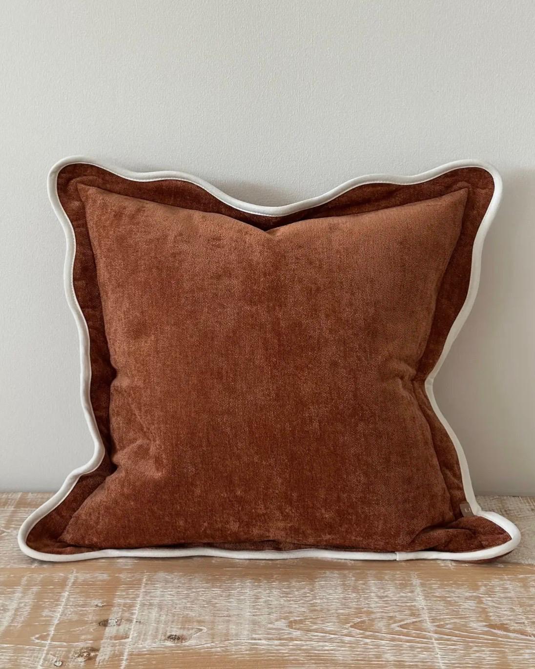 Rust brown and cream scalloped cushion cover by Ellenvale Trade, soft furnishings with decorative scalloped edges.
