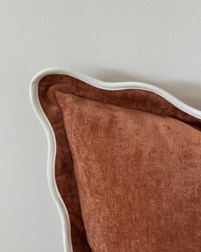 Rust brown and cream scalloped cushion cover by Ellenvale Trade, soft furnishings with decorative scalloped edges.