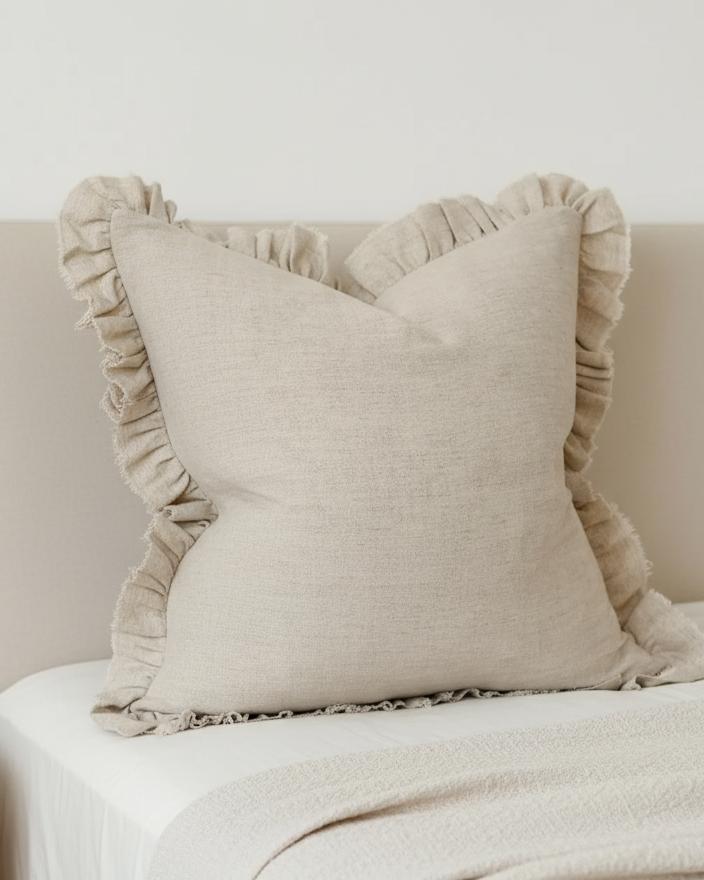 Grace beige square ruffle cushion cover by Ellenvale Trade, extra large soft furnishings with ruffled edges on a plush cushion.