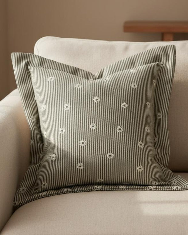 Olive green square cushion cover with daisy pattern from Ellenvale Trade, soft furnishings decor for sofa or bed.