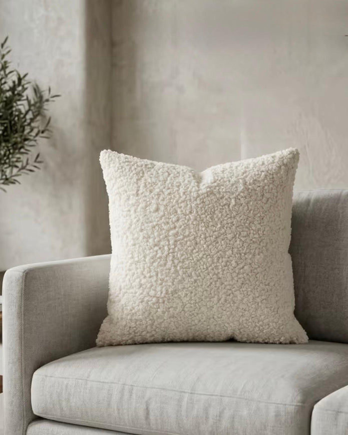 Cream boucle cushion cover from Starlight Express, soft and textured throw pillow for cozy home decor.