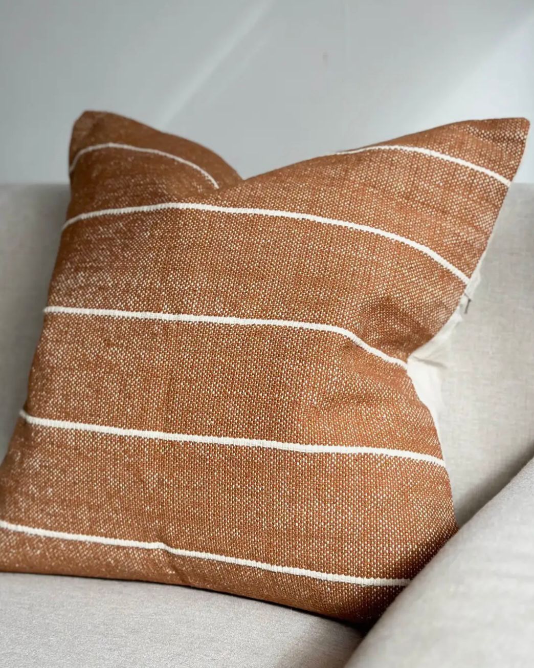 Rust brown and white pinstripe cotton cushion cover by Ellenvale Trade, soft furnishings with a sleek, stylish design.