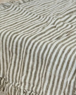 Olive green linen pinstripe table runner from Ellenvale Trade, soft furnishings with elegant, natural fabric and subtle pinstripe design.