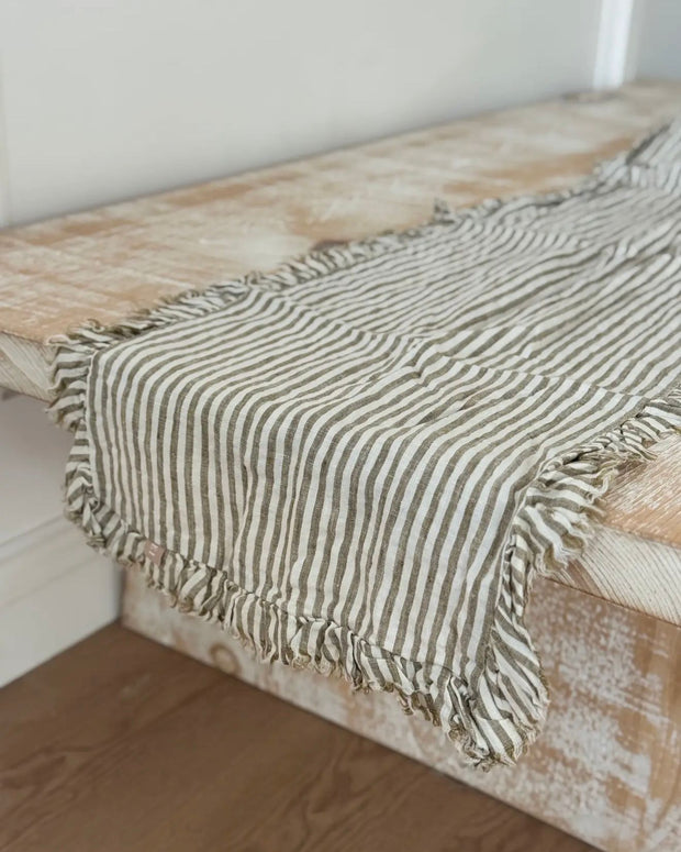 Olive green linen pinstripe table runner from Ellenvale Trade, soft furnishings for elegant dining decor.