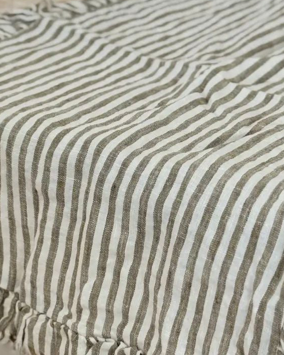 Olive green linen pinstripe table runner from Ellenvale Trade, soft furnishings with elegant, natural fabric and subtle pinstripe design.