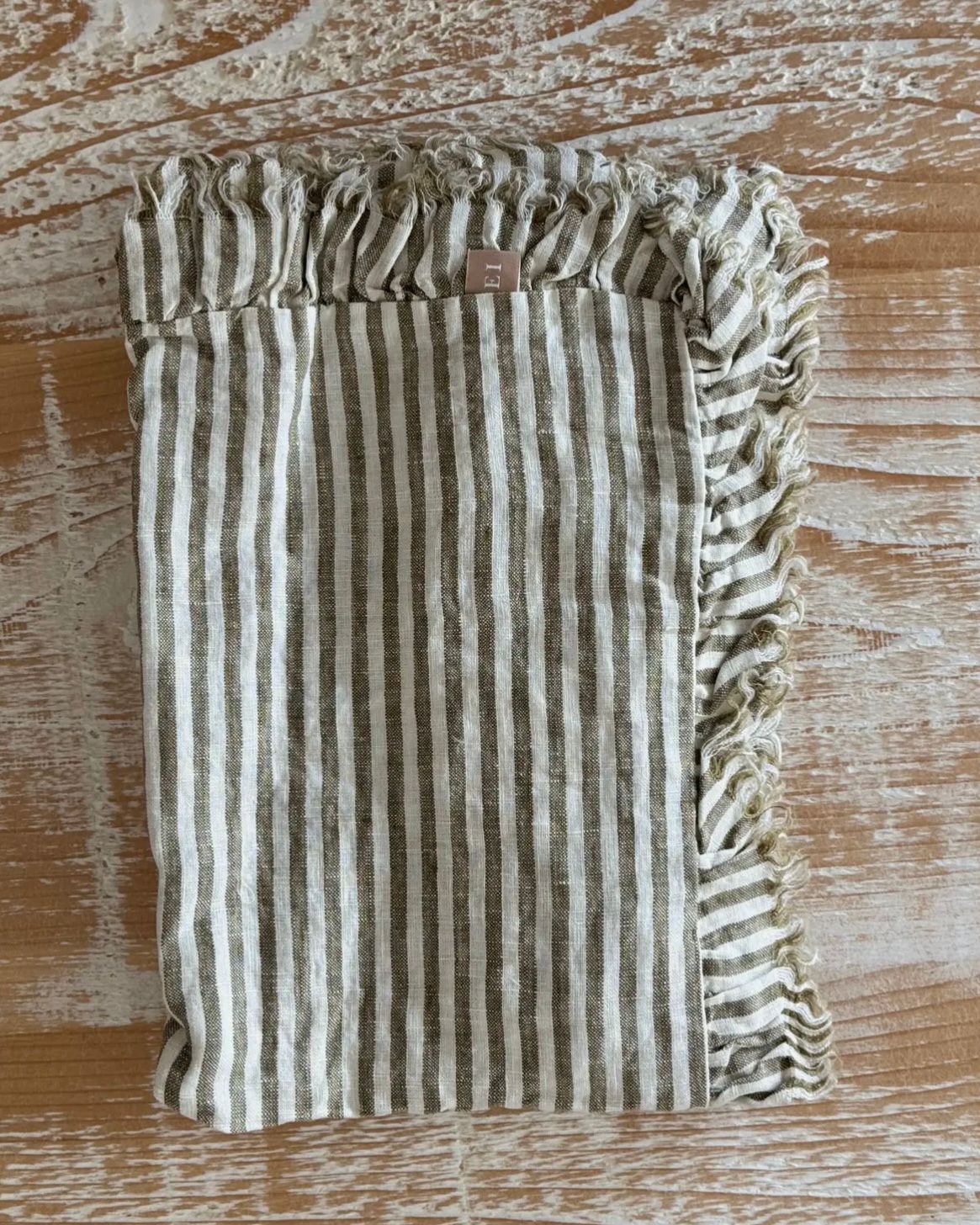 Olive green linen pinstripe table runner from Ellenvale Trade, soft furnishings, with a smooth fabric and elegant design.