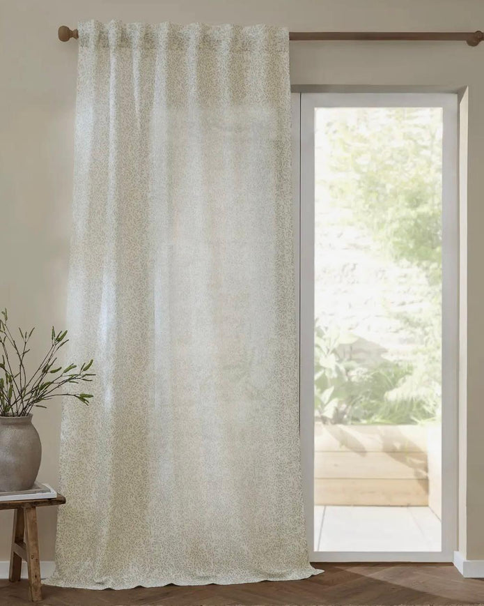 Riva Home yard leaf patterned natural woven sheer voile curtain panel hanging with soft, flowing fabric for elegant window decor.