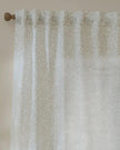 Natural woven voile curtain panel with yard leaf pattern, soft sheer fabric from Riva Home, ideal for light and airy window decor.